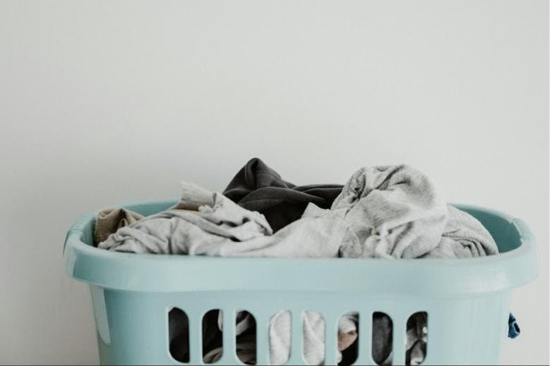 Laundry basket full of household linens
